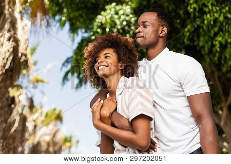 Outdoor Protrait Of Black African American Couple Embracing Each Other