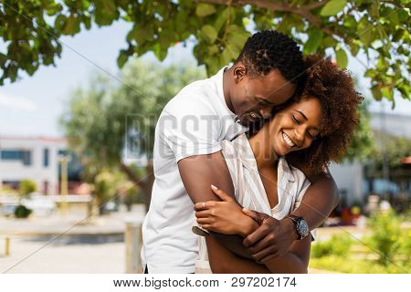 Outdoor Protrait Of Black African American Couple Embracing Each Other