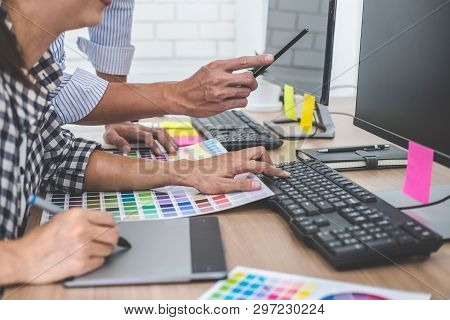 Young Creative Team Having A Meeting In Creative Office, Architectural Drawing With Work Tools And A