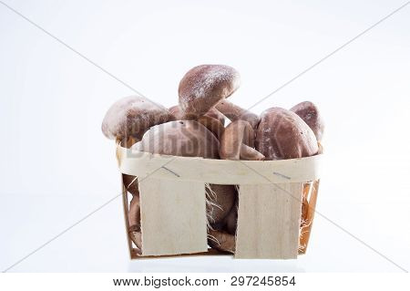 Mushrooms in a wooden basket. Mushrooms in the window.