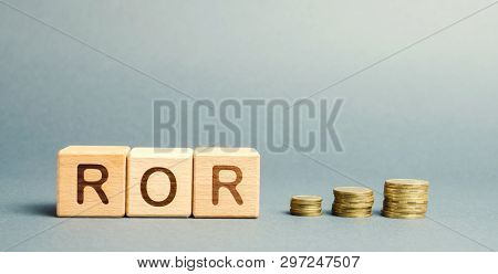 Wooden Blocks With The Word Ror. Rate Of Return. The Level Of Profitability Or Loss Of Business. Fin