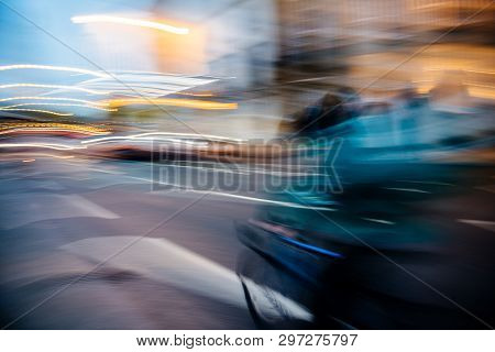 Abstract Defocused Light-trails Of Fast Cyclist Silhouette Delivering Food Ordered Through Mobile Ap