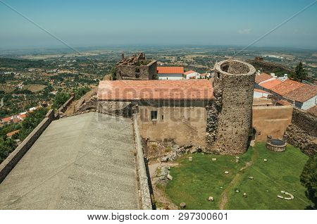 Green Lawn On Castle Central Courtyard Among Stone Walls And Round Tower, In A Sunny Day At Castelo 