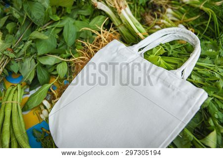 Eco Cotton Fabric Bag On Fresh Vegetables In The Market Free Plastic Shopping / Zero Waste Use Less 