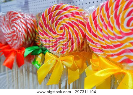 Rainbow Lollipop Swirl On Wooden Stick In Candy Store, Selective Focus.sweet Candy.candy Bar.lollipo