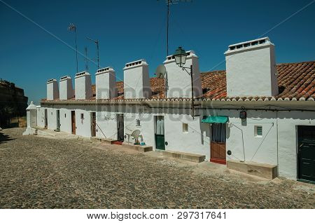 Campo Maior, Portugal - July 8, 2018. Houses With Large Chimney Along Cobblestone Street At Campo Ma