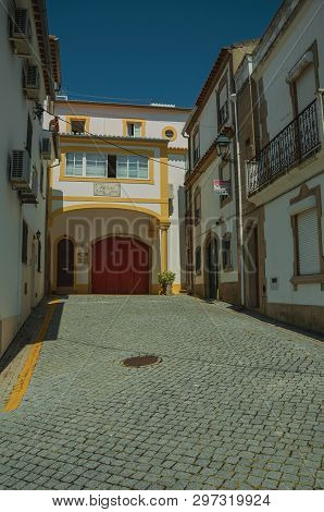 Castelo De Vide, Portugal - July 10, 2018. Facade Of Old Colorful Houses In Deserted Alley On Slope 