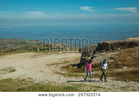 Serra Da Estrela, Portugal - July 12, 2018. Woman And Girl Walking Up In A Trail On Highlands At The