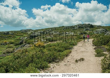 Serra Da Estrela, Portugal - July 12, 2018. Woman And Girl Walking Along A Trail On Highlands At The