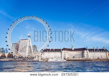 England London - April 20, 2019: London Eye Near County Hall In Summer View From Thame River Boat Cr
