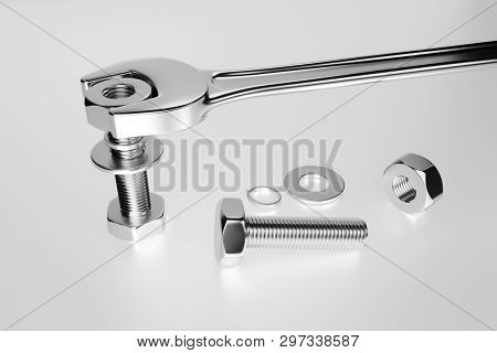 Wrench With Bolt And Nut On White Background. 3d Rendering