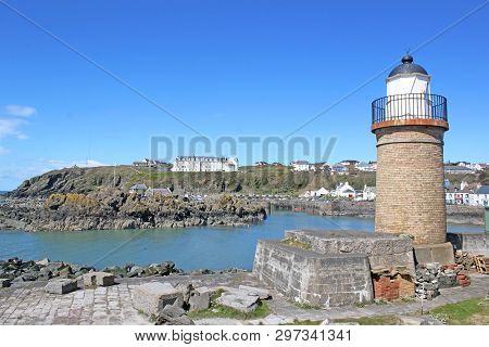 Portpatrick Lighthouse And Village In Galloway, Scotland