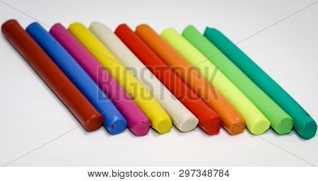 Colorful Children Play Dough Lies In A Row Next To Each Other
