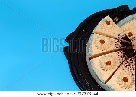 Cake Biscuit In A Brown Substrate On A Blue Background