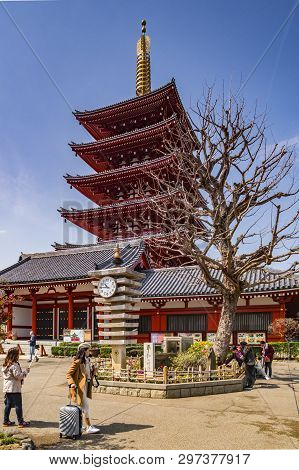 25 March 2019: Tokyo, Japan - The Five-storey Pagoda And Clocktower At Senso-ji Buddhist Temple, Tok