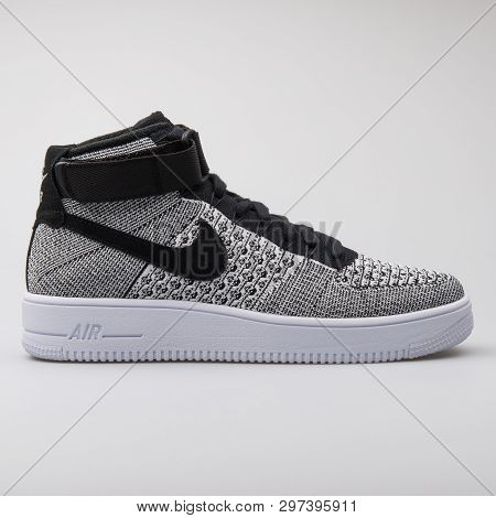 Vienna, Austria - August 7, 2017: Nike Air Force 1 Ultra Flyknit Mid Black And White Sneaker On Whit