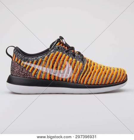 Vienna, Austria - August 7, 2017: Nike Roshe Two Flyknit Black And Orange Sneaker On White Backgroun