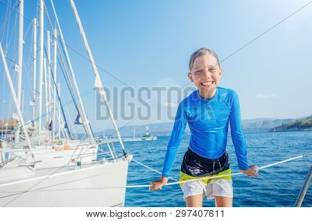 Little Boy Having Fun On Board Of Yacht On Summer Cruise. Travel Adventure, Yachting With Child On F