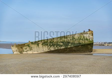 The Remains Of The Mulberry Harbour At Arromanches, Normandy France
