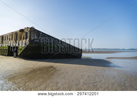 The Remains Of The Mulberry Harbour At Arromanches