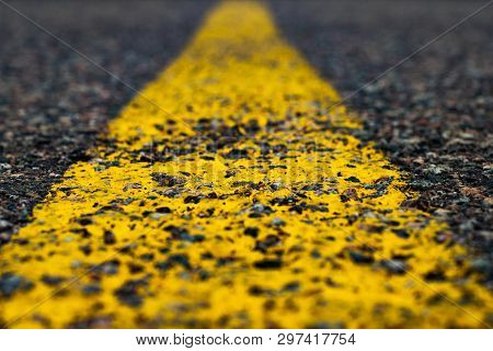 Road Marking Line With Yellow Paint On Asphalt. Marking The Motorway. Close-up
