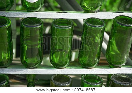 Photo Of Several Botels With Green Colour And Sunlight