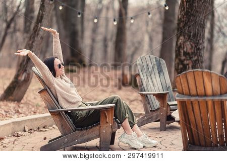 Woman Relaxing In The Forest On Weekeend