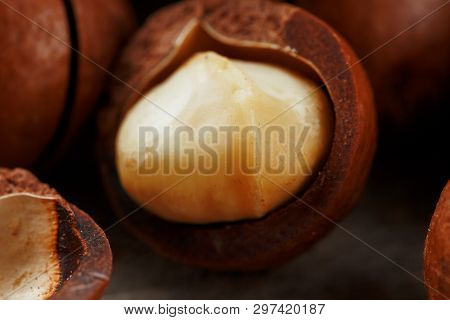 Macadamia Nut On A Wooden Table In A Bag, Closeup, Top View
