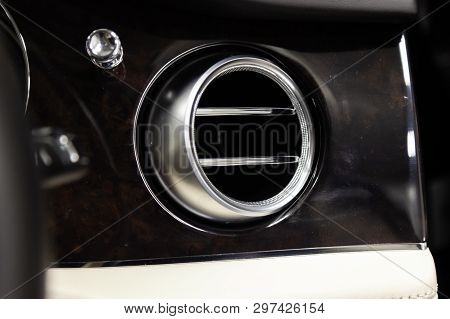 A Close-up View Of A Part Of The Interior Of A Modern Luxury Car With A View Of The Ventilation Chro