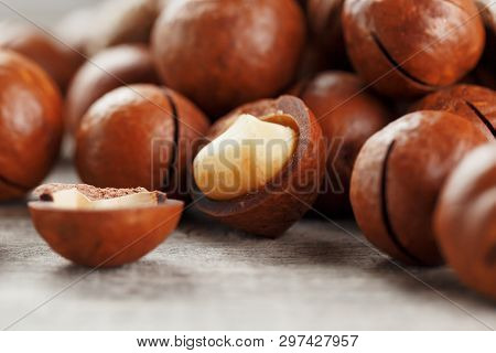 Macadamia Nut On A Wooden Table In A Bag, Closeup, Top View