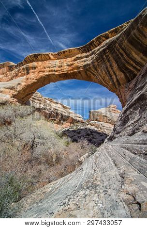 A Rock Bridge Over A Canyon At Natural Bridges National Monument.