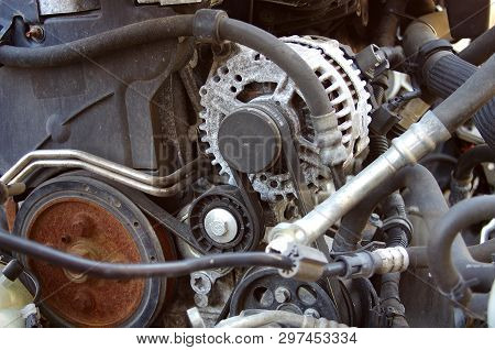 Old And Rusty Car Parts Like Brake Discs,axles And Engines.