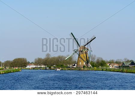Waterways Of North Holland And View On Traditional Dutch Wind Mill, Spring Landscape