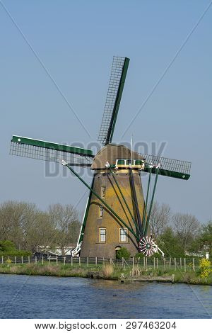 Waterways Of North Holland And View On Traditional Dutch Wind Mill, Spring Landscape