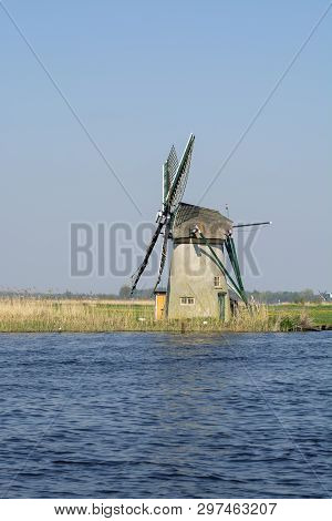 Waterways Of North Holland And View On Traditional Dutch Wind Mill, Spring Landscape