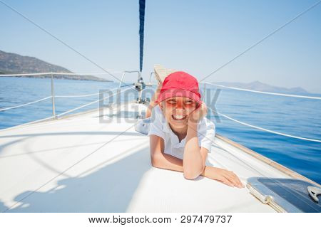 Little Boy Having Fun On Yacht On Summer Cruise. Travel Adventure, Yachting With Child On Family Vac