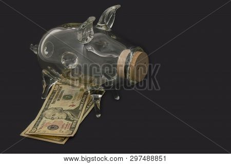 A See Through Piggy Bank With Money Coins