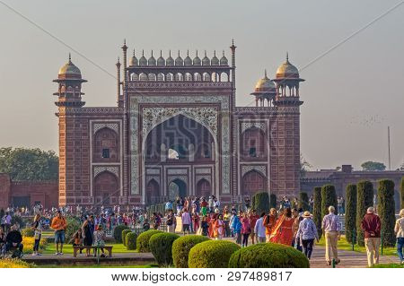 Agra, India - March 5 2018: Tourists Sighteseeing, Exploring And Admiring Famous The Taj Mahal