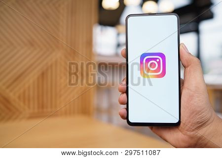 Chiang Mai, Thailand - Mar. 23,2019: Man Holding Xiaomi Mi Mix 3 With Instagram Application On The S