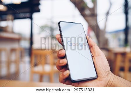Chiang Mai, Thailand - Mar. 23,2019: Man Holding Xiaomi Mi Mix 3 With Google Search On Screen. Googl
