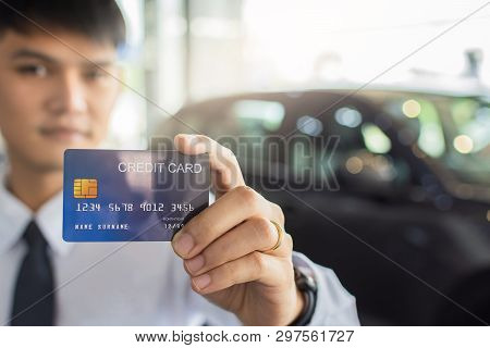 Man Holding Credit Card For Blurred Bokeh Background E-shopping Marketing Digital, Consumer Purchase