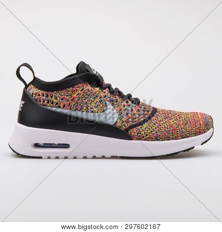 Vienna, Austria - August 7, 2017: Nike Air Max Thea Ultra Flyknit Crimson, Grey And Black Sneaker On