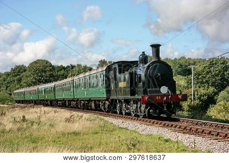 Drummond M7 Steam Locomotive No. 53 Approaches Corfe Castle On The Swanage Railway - Corfe Castle, D