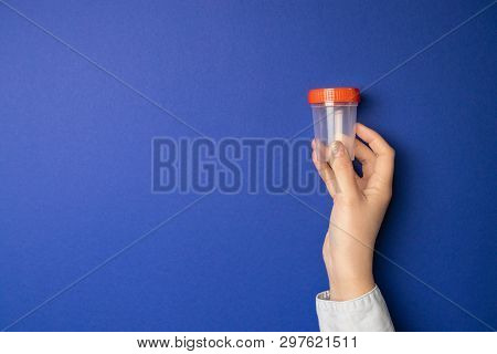 Doctor Holding Sample Cup. Medical Test For Urine In Hospital.