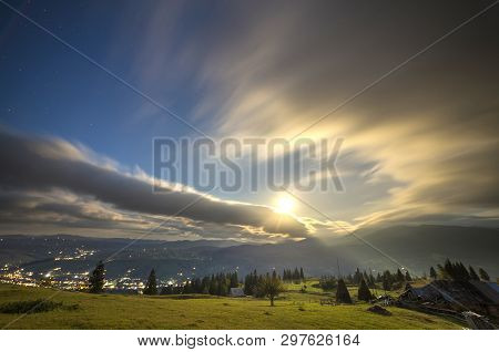 Summer Night Mountain Panorama. Green Grassy Mountain Clearing, Spruce Trees On Blue Evening Sky Cop