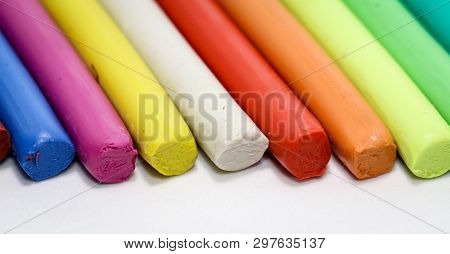 Colorful Children Play Dough Lies In A Row Next To Each Other