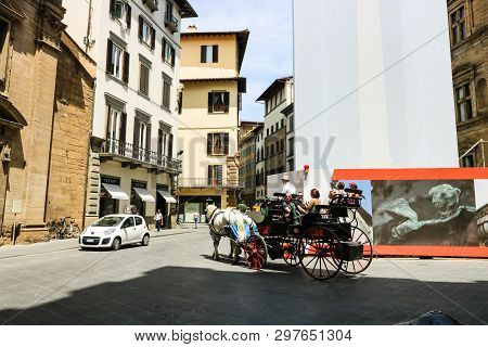 Florence, Italy - 2019. Tourists People With Tour Guide Riding Horse Carriage Outside On Summer Day 