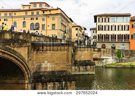 Florence, Italy - 2019. Tourists Crossing Old Medieval Bridge In Florence.