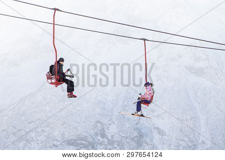 Dombai, Russia - January 3, 2014: People Are Lifting On Open Lft High Up In Caucasus Mountains