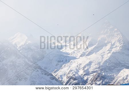 Dombai, Russia - January 3, 2014: People Are Lifting On Open Lft High Up In Caucasus Mountains